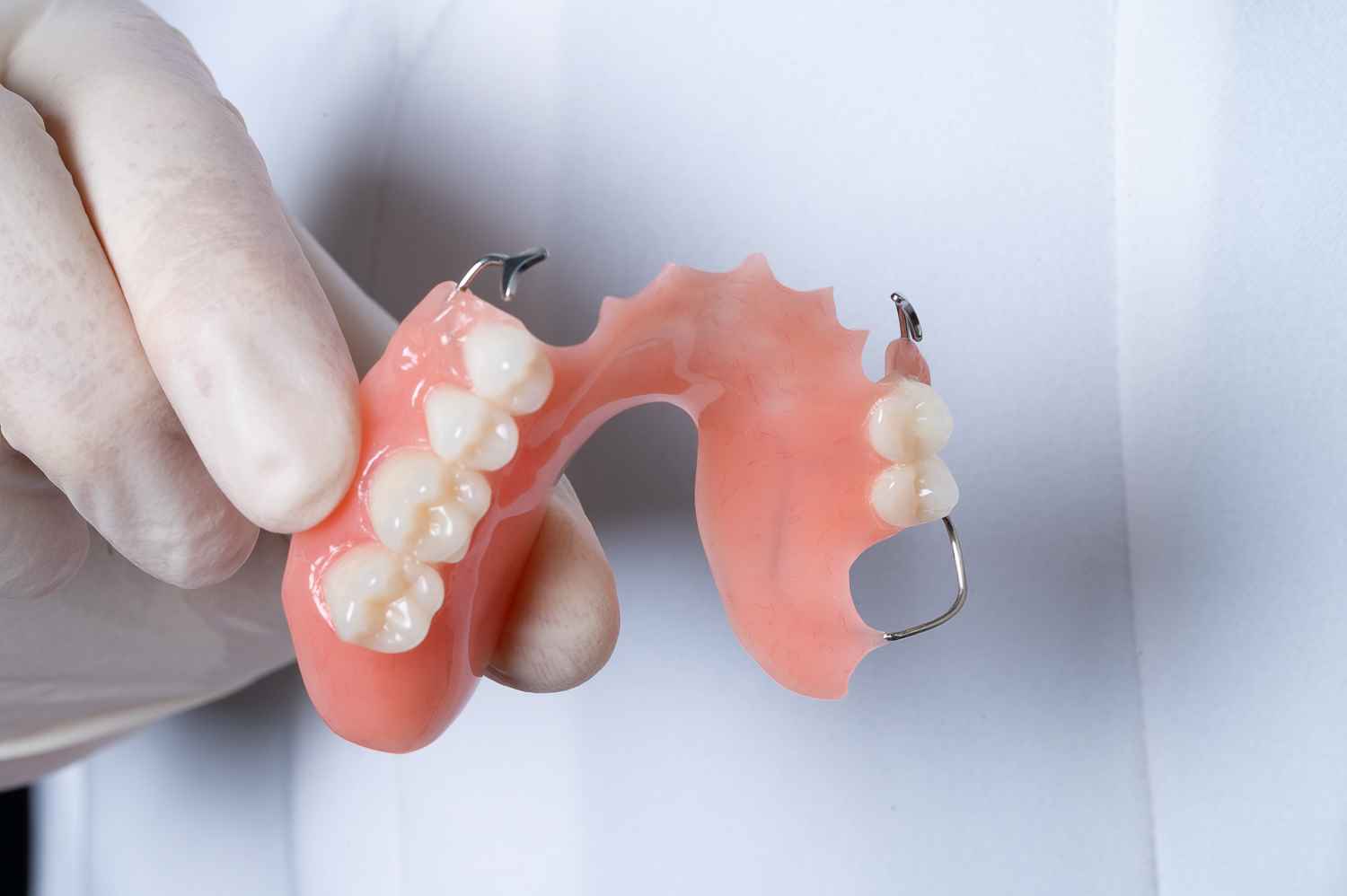 Premium acrylic denture close-up with detailed base finish